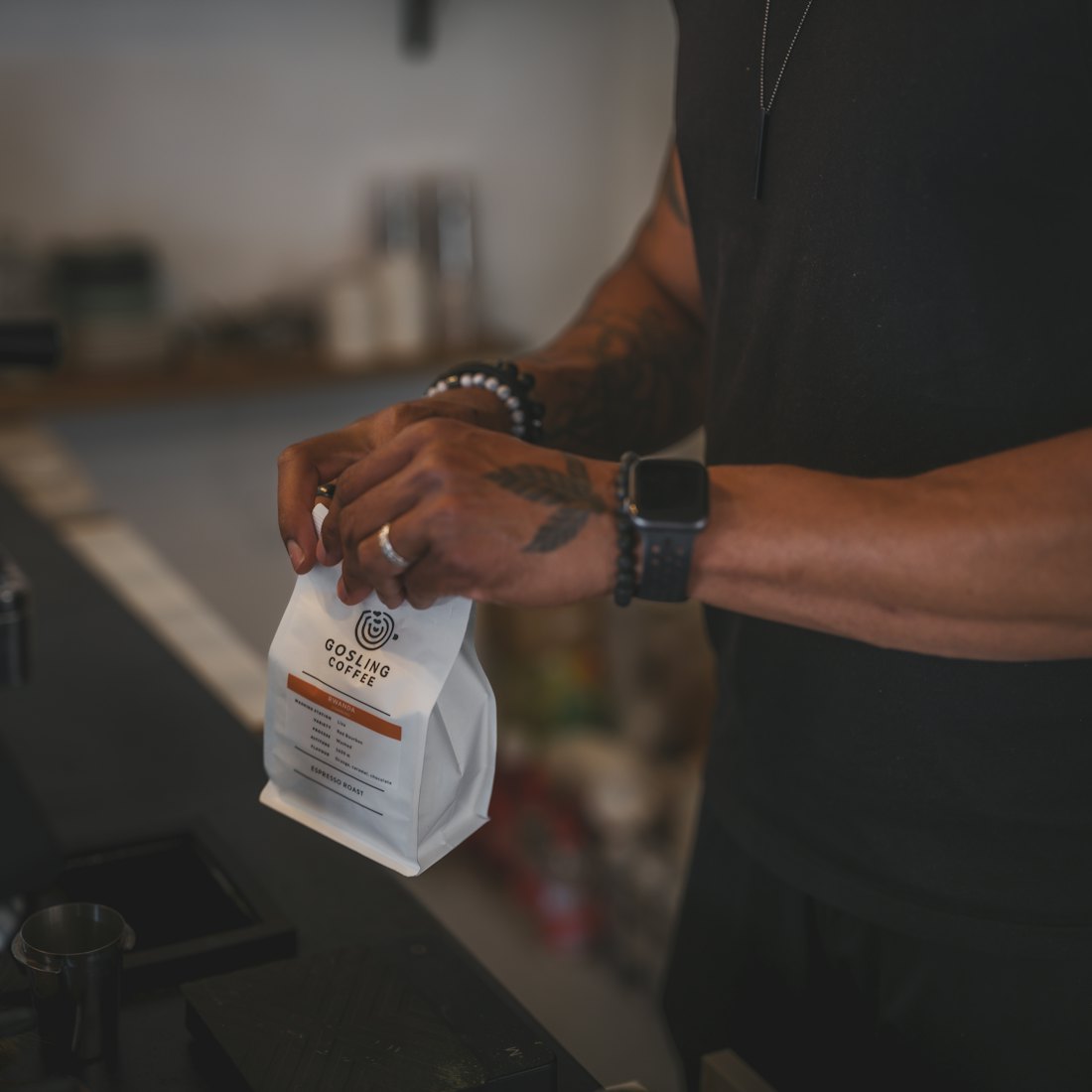 A person opens a bag of coffee