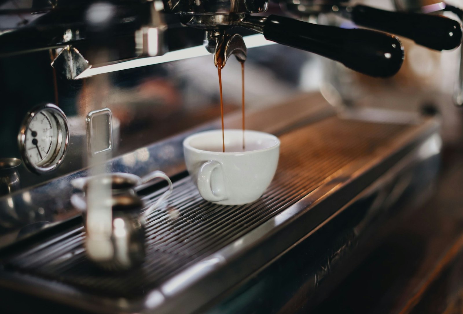 White ceramic cup on brown wooden table
