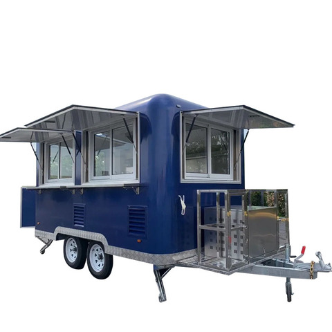 Twin hatch catering trailer with both service windows propped open.