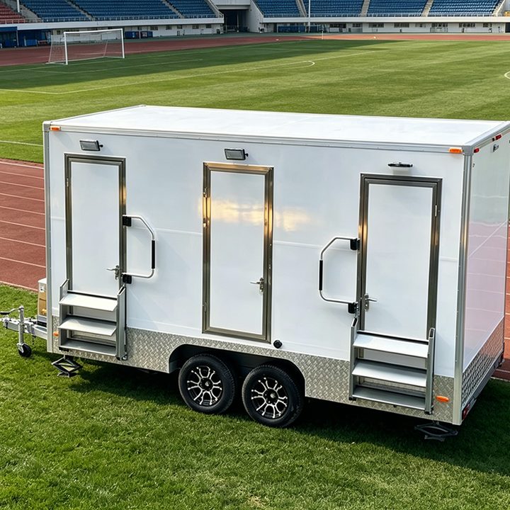 Three door washroom trailer on a twin axle chassis with the entrance steps deployed.